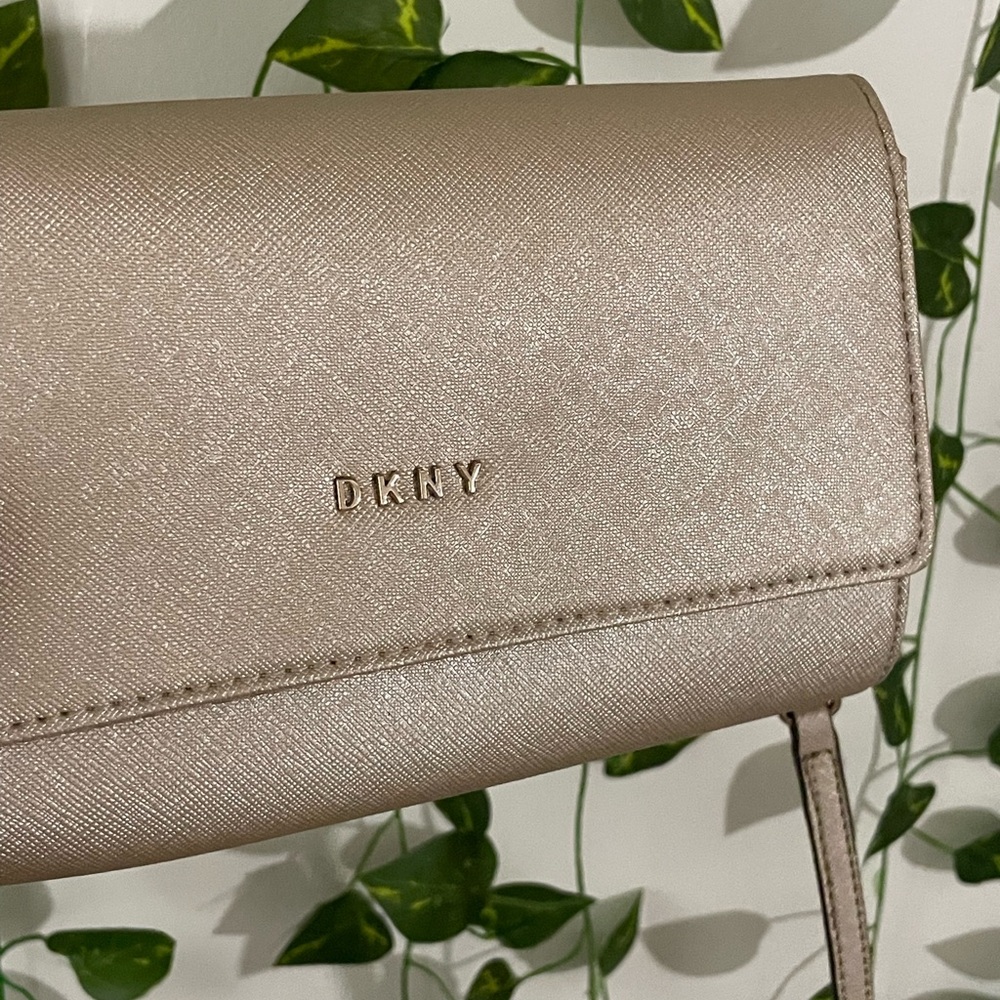 DKNY bag, gold, never used, no callouts, retails for $200 BNIB